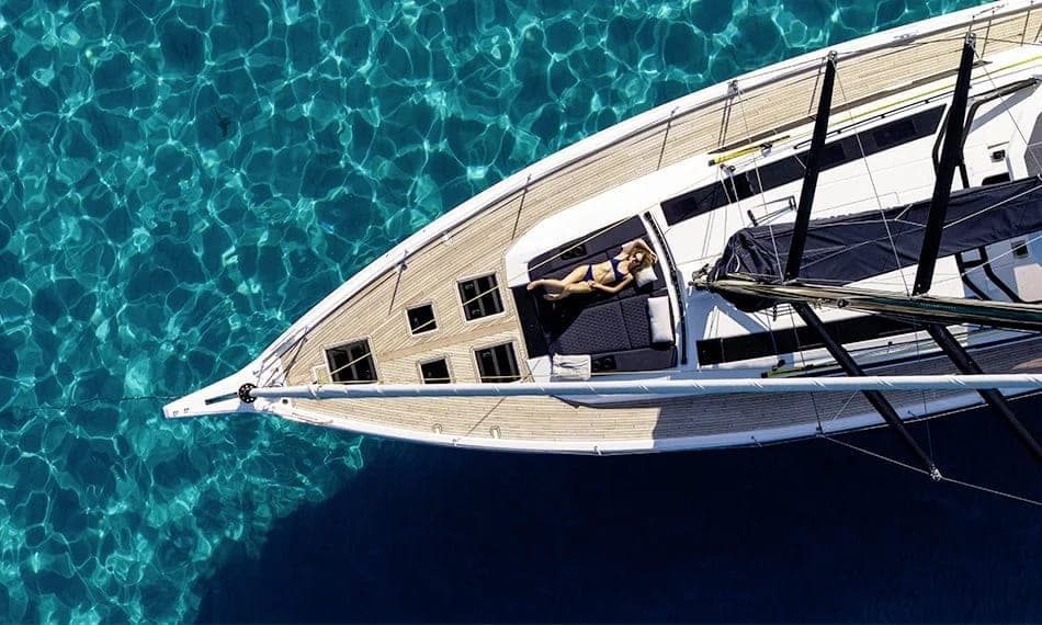 Sailing yacht seen from above on turquoise water