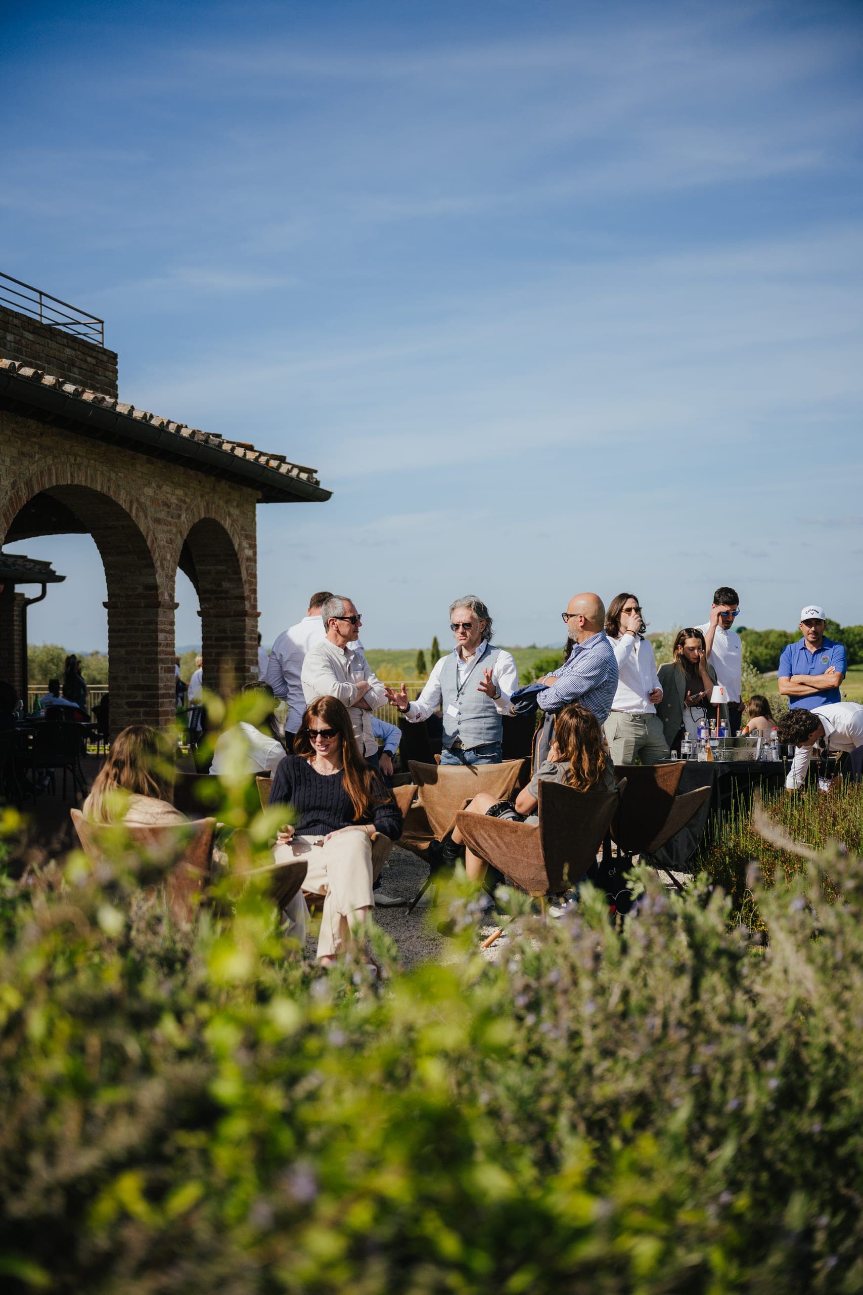 Guests relaxing in the sun on a hilltop terrace